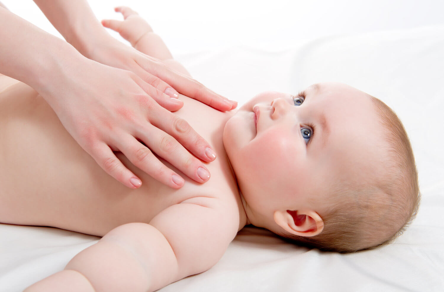 baby massage clases in brighton - baby with mothers hands on chest